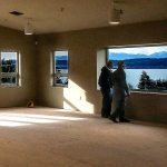 Ray Harrison (left), Mark Peterson and Jon Rice pause to take in the view from the Fellowship Room upstairs in Camano Chapel&rsquo;s new Saratoga Hall. Harrison is a member of the administrative board and his role is overseeing facilities. Peterson is the facilities director as well as project manager. Jon Rice is the church administrator. The Fellowship Room is fire-approved for 450 people. (Dan Bates / The Herald)