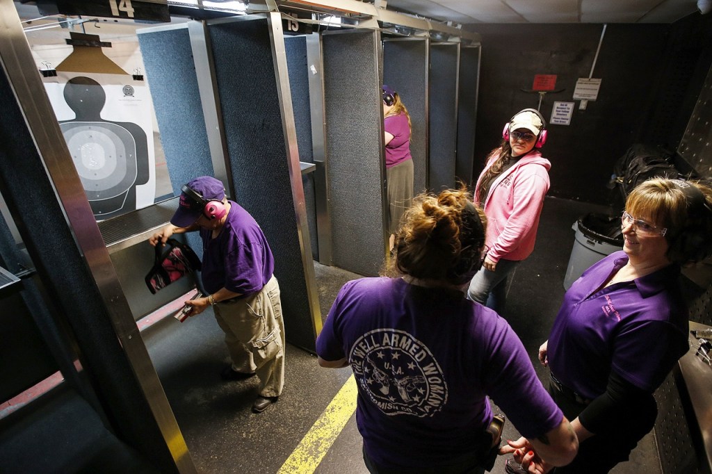 Members of Snohomish County&rsquo;s chapter of The Well Armed Woman pack up after a practice session at the Norpoint Shooting Center in Arlington on Saturday, Feb. 4. (Ian Terry / The Herald)