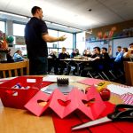 Wounded Warrior Fellow Benjamin Studley talks to Julie Blue&rsquo;s fifth-grade students Thursday, and answers questions they ask about the Navy and a variety of other subjects. (Dan Bates / The Herald)