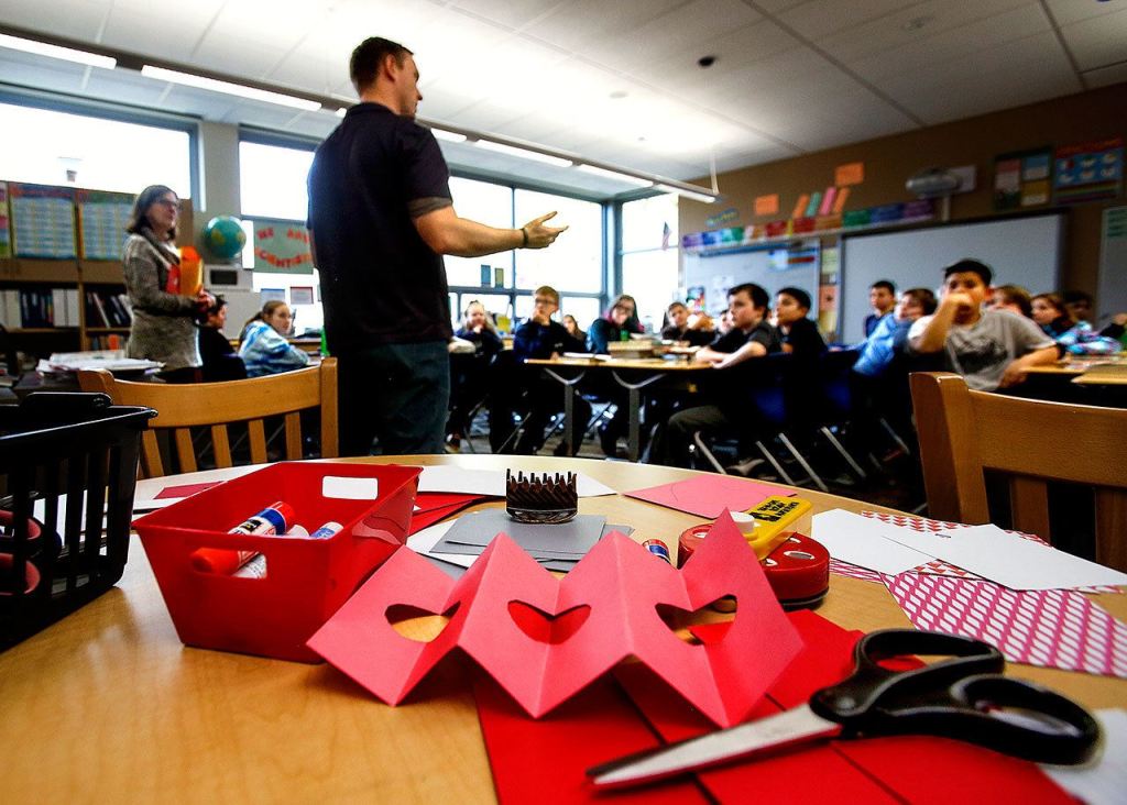 Wounded Warrior Fellow Benjamin Studley talks to Julie Blue&rsquo;s fifth-grade students Thursday, and answers questions they ask about the Navy and a variety of other subjects. (Dan Bates / The Herald)