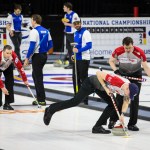 Skip Brady Clark watches closely as his teammates furiously sweep the ice during the USA Curling Nationals at the Xfinity Arena on Sunday, Feb. 12, in Everett. (Daniella Beccaria / The Herald)
