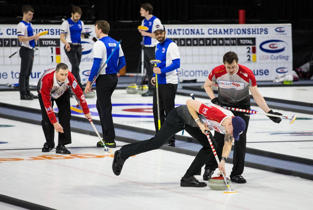 Skip Brady Clark watches closely as his teammates furiously sweep the ice during the USA Curling Nationals at the Xfinity Arena on Sunday, Feb. 12, in Everett. (Daniella Beccaria / The Herald)