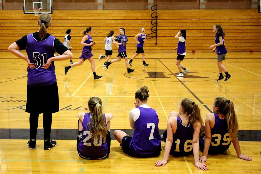 Kamiak players wait their turn as teammates scrimmage during practice Feb. 23, 1017, at Kamiak High School in Mukilteo. (Kevin Clark / The Herald)