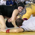 Kamiak&rsquo;s Ally DeLa Cruz works to pin Sequim&rsquo;s Alma Mendoza in the 155-pound weight class Saturday during Mat Classic XXIX on Saturday. (Kevin Clark / The Herald)