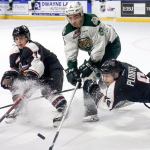 Vancouver&rsquo;s Ty Ronning (L-R), Everett&rsquo;s Patrick Bajkov and Vancouver&rsquo;s Dylan Plouffe vie for control of the puck Saturday night at Xfinity Arena in Everett on February 4, 2017. (Kevin Clark / The Herald)