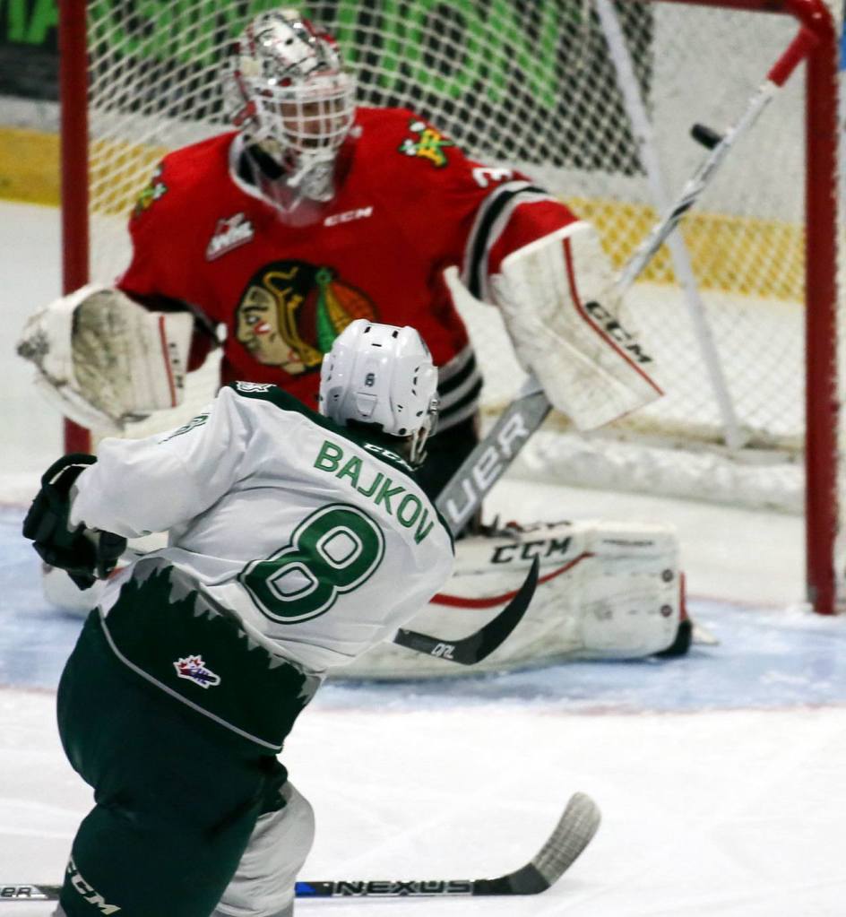 Everett&rsquo;s Patrick Bajkov shoots and scores against Portland&rsquo;s goalie Cole Kehler during a game Feb. 24, 2017, at Xfinity Arena in Everett. (Kevin Clark / The Herald)