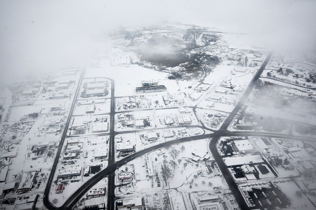 The snowy streets of Moses Lake are seen from a Honeywell test plane on Thursday, Feb. 9. (Ian Terry / The Herald)