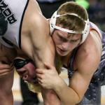 Stanwood&rsquo;s Mason Phillips (right) wrestles Bonney Lake&rsquo;s Mason Sabin in the 145-pound championship match at Mat Classic XXIX on Feb. 18, 2017, in Tacoma. (Kevin Clark / The Herald)