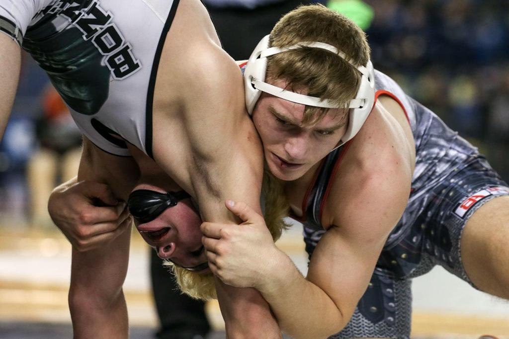 Stanwood&rsquo;s Mason Phillips (right) wrestles Bonney Lake&rsquo;s Mason Sabin in the 145-pound championship match at Mat Classic XXIX on Feb. 18, 2017, in Tacoma. (Kevin Clark / The Herald)
