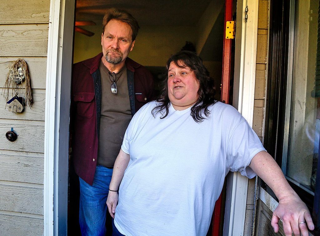 Stephanie Powell Leisure and her husband, Tony, are hoping a federal lawsuit will provide answers about her brother&rsquo;s death at the Monroe Correctional Complex in 2015. (Dan Bates / The Herald)