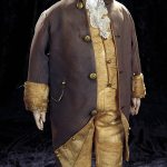 This is a George Washington doll made of painted cloth. The face and clothing are familiar and he really did have blue eyes. It recently sold for $3,080.