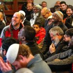 A packed crowd at DarAlarquam Mosque appeared to receive Lynnwood Police Chief Tom Davis warmly Friday as he spoke about immigration poilicy and how the police department and Muslim community can work together. (Dan Bates / The Herald)