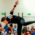 Break dancer Jerome Aparis dazzles students with mid-air moves Feb. 3 at Emerson Elementary School where 21 languages are spoken. (Dan Bates / The Herald)