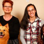 Everett&rsquo;s Wendy Whiteley (left) with Zoom, her Finnish Spitz, gets together at her Lowell neighborhood home with Shahntae Martinez and her Field Spaniel, Hudson. Martinez, a 17-year-old Sequoia High School student, and Whiteley will compete with their dogs next week at the Westminster Kennel Club Dog Show in New York City. (Dan Bates / The Herald)