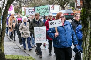 Few dozen march in Everett to support immigrants, refugees