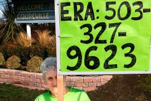 Mary Whitmore, who worked for ratification of the Equal Rights Amendment in the 1970s and &rsquo;80s, holds a sign to demonstrate her support of a new push for the ERA last weekend in Coupeville. The amendment fell short of ratification, by three states, before a 1982 deadline. Whitmore is heading a new Island County Democrats ERA committee. (Courtesy Mary Whitmore)