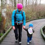 Heather Romano walks with Giovanni Romano on his 100th hike, shortly before his second birthday. (Craig Romano)