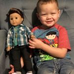 Logan Everett the doll with Everett-born Brandt Logan Glomski, 3, of Lake Stevens. His great-aunt bought him the first-ever boy American Girl doll. It&rsquo;s the boy&rsquo;s first doll and his mom said the two are inseparable. (Photo by Barbara Nitta)
