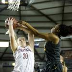 Stanwood&rsquo;s Kaitlin Larson (30) has her shot blocked by Lincoln&rsquo;s Azallee Johnson during a girls 3A state quarterfinal game at the Tacoma Dome on Thursday, March 2. Lincoln went on to defeat Stanwood 53-37. (Ian Terry / The Herald)