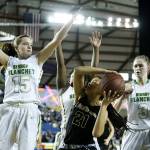 Lynnwood&rsquo;s Valerie Bell (21) is pressured by Bishop Blanchet defenders Ella DiPietro (left), Taylor Chambers and Katie Merrywell (right) during a girls 3A state quarterfinal game at the Tacoma Dome on Thursday, March 2. Bishop Blanchet went on to defeat Lynnwood 58-57. (Ian Terry / The Herald)