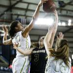 Lynnwood&rsquo;s Rachel Walsh (3) has her shot blocked by Bishop Blanchet&rsquo;s Jadyn Bush (left) during a girls 3A state quarterfinal game at the Tacoma Dome on Thursday, March 2. Bishop Blanchet went on to defeat Lynnwood 58-57. (Ian Terry / The Herald)