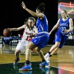Snohomish&rsquo;s Maya Duchesne (left) drives on Seattle Prep defender Chinwe Ezeonu (center) during a girls 3A state quarterfinal game on March 2, 2017, at the Tacoma Dome. Snohomish won 53-36. (Ian Terry / The Herald)