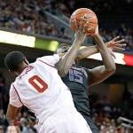 Washington&rsquo;s Noah Dickerson (right) is fouled by Southern California&rsquo;s Shaqquan Aaron during the Huskies&rsquo; loss to the Trojans on March 4 in Los Angeles. Dickerson will lead short-handed UW in another matchup against USC in its Pac-12 tournament opener on Wednesday in Las Vegas. (AP Photo/Jae C. Hong)