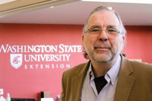 Dr. Tim Lawrence, director of Washington State University&rsquo;s Island County Extension in Coupeville, explains how a meeting room will be used for WSU classes using video-conferencing equipment. (Photo by Ron Newberry / Whidbey News-Times)