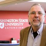 Dr. Tim Lawrence, director of Washington State University&rsquo;s Island County Extension in Coupeville, explains how a conference room will be used for WSU classes using video-conferencing equipment. (Photo by Ron Newberry / Whidbey News-Times)