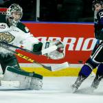 Silvertips goalie Carter Hart (center) eyes the puck during Game 1 of the opening-round playoff series against the Royals on March 24, 2017, at Xfinity Arena in Everett. (Ian Terry / The Herald)