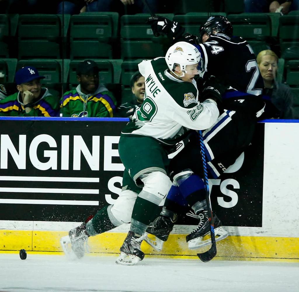 Everett&rsquo;s Wyatte Wylie (left) lays a hit on Victoria&rsquo;s Regan Nagy during Game 1 of their opening-round playoff series on March 24, 2017, at Xfinity Arena in Everett. (Ian Terry / The Herald)