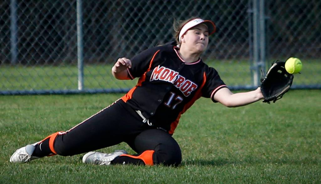 Monroe&rsquo;s Hanna Hvitved makes a diving catch in the outfield during a game against Jackson on March 31, 2017, at Jackson High School. (Ian Terry / The Herald)