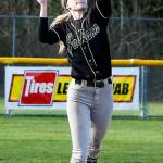 Jackson shortstop Kristina Day makes a leaping catch before throwing to first base for a double play in the seventh inning of a game against Monroe on March 31, 2017, at Jackson High School. (Ian Terry / The Herald)