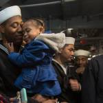 Seaman Sean Tender and daughter Sydney, 2, hold each other after the USS Kidd docks at Everett Naval Station on Nov. 21. (Andy Bronson / The Herald)