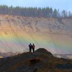 A rainbow appears in front of Andy Huestis and his girlfriend Alisha Garvin as they and other families gather to remember the victims of the Oso mudslide on Wednesday, March 22, in Oso. Huestis&rsquo; sister, Christina Jefferds, and her baby granddaughter, Sanoah Violet Huestis, were among the 43 people killed in the mudslide. (Andy Bronson / The Herald)
