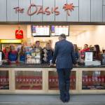 Gov. Jay Inslee talks with DECA Club students at the Oasis Cafe, the student store, Tuesday in Marysville Pilchuck High School&rsquo;s new cafeteria. (Andy Bronson / The Herald)