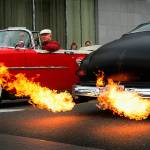 To the amazement of onlookers, flames shoot out the exhaust pipes on Les Sanders&rsquo; black 1950 Mercury Coupe as he drives up and down Colby Avenue with many others in classic and custom automobiles during one of the many popular Cruzin&rsquo; to Colby events held each summer in Everett. (Dan Bates / The Herald)