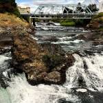 The Spokane River, photographed last summer from Riverfront Park in downtown Spokane. Gonzaga University, which will play this weekend in the NCAA Final Four basketball championships, is located on the river&rsquo;s north bank. (Dan Bates / The Herald)