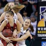 Stanford&rsquo;s Karlie Samuelson and Oregon State&rsquo;s Mikayla Pivec fight for possession of the ball in the first half of the Pac-12 Conference championship game Sunday at KeyArena in Seattle. (AP Photo/Elaine Thompson)