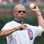 Former Chicago Bears running back Gale Sayers throws out a ceremonial first pitch before a Major League Baseball game between the Chicago Cubs and Atlanta Braves on July 11, 2014 at Wrigley Field in Chicago. (AP Photo/Andrew A. Nelles)