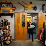 Providing more than the expected: Diane Pedack works with the children&rsquo;s clothes inventory at Operation School Bell, which includes a selection of fine hand-knitted hats and scarves. (Dan Bates / The Herald)