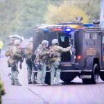 A SWAT team surrounded a central Everett home on Wednesday afternoon. (Kevin Clark / The Herald)