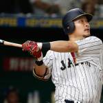 Japan&rsquo;s Yoshitomo Tsutsugo hits a two-run homer off Cuban pitcher Jonder Martinez in the seventh inning of their World Baseball Classic game Tuesday in Tokyo. (AP Photo/Shizuo Kambayashi)