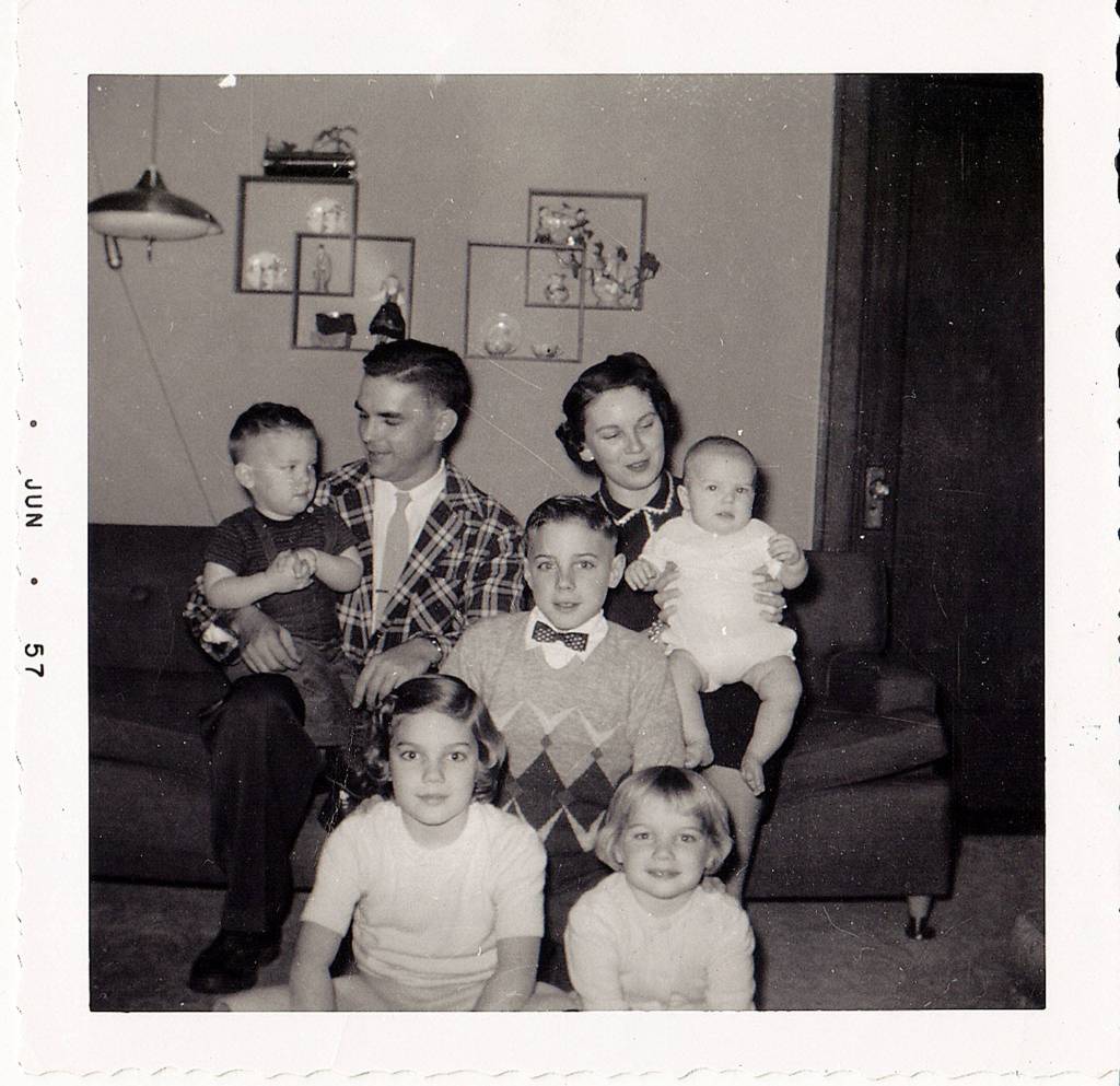 The Wiggums in their Oaks street home in 1956. Arnie Wiggum holds Paulin his lap as Irene holds Dave. In the middle is the oldest, Matt, lower left is sister Jan (Morberg) and lower right is sister Chris (Alexander). (Photo courtesy the Wiggum family)