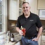 Andrew Holes is the founder of J. Wilbur Foods which makes three types of barbecue sauce as well as a bloody mary drink flavoring. (Ian Terry / The Herald)