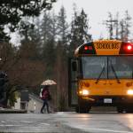 A school bus driven by Jan Bates stops on 83rd Avenue Northeast in Marysville on Tuesday. Bates&rsquo; bus, along with 14 others in the district, has been equipped with cameras to record drivers who illegally pass the bus when its &ldquo;stop&rdquo; paddle is out. (Ian Terry / The Herald)
