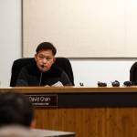 Jimmy Matta (left) addresses Commissioners David Chan (center left) and Bob Meador during a meeting at Fire District 1 in Everett on Tuesday. (Ian Terry / The Herald)