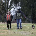 Woodinville residents (from left) Bill Stankus, Nancy Bacon and Wayne Sesser walk Roxy and Chloe through Wellington Hills, a former golf course, on March 3. Talk of developing the land, which is owned by Snohomish County, has some neighbors worried about harm to wildlife and overcrowding in the semirural area. (Ian Terry / The Herald)