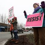 Mary Dickinson (right), waves to passing cars along 2nd Street in Snohomish along with Shayla McNatt (center left) and Izabel Babic during an International Women&rsquo;s Day gathering to commemorate and advocate women&rsquo;s rights on Wednesday. Millions of women across the globe took part in Wednesday&rsquo;s strikes, protests and gatherings to raise awareness for issues like pay inequality, educational opportunities and women&rsquo;s reproductive rights. (Ian Terry / The Herald)