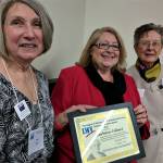 Joan Smith (left) and Pat Fogarty Cramer (right) present Barbara Tolbert with the League of Women Voters of Snohomish County&rsquo;s 2017 Democracy in Action award. (Contributed photo)